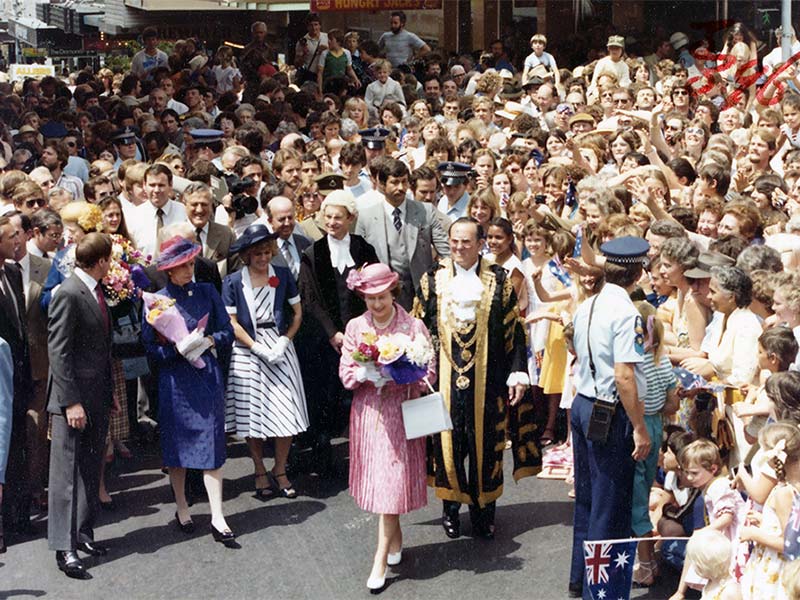 Queen Elizabeth II escorted by Brisbane Lord Mayor Alderman Roy Harvey along Queen St Mall, Brisbane, 7 October 1982