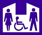 blue sign with an icon of a person in a wheelchair between male and female icons inside a white shelter