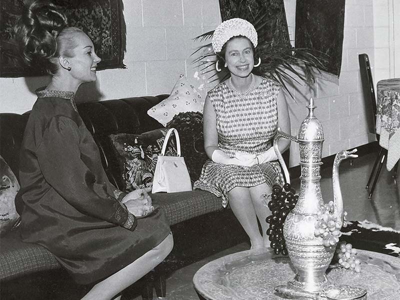 Queen Elizabeth II visits Mrs. E. Egorov (left), who presented her new flat typical of workers at the Mount Isa mines, 16 April 1970