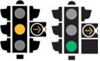 Traffic lights showing the yellow arrow lit up