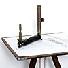 A drawing board mounted on a tripod for plotting survey data in the field