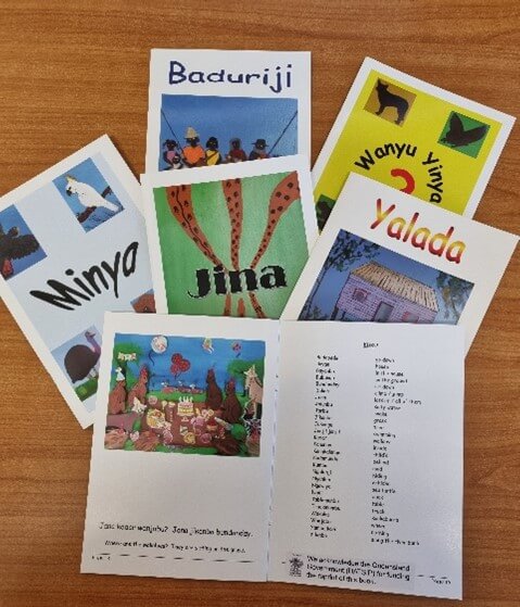 Muruku Art Group's early readers resources displayed on a table