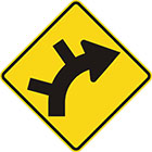 yellow diamond-shaped sign with black arrow that curves steadily right with 2 lines branching off the outside of the curv