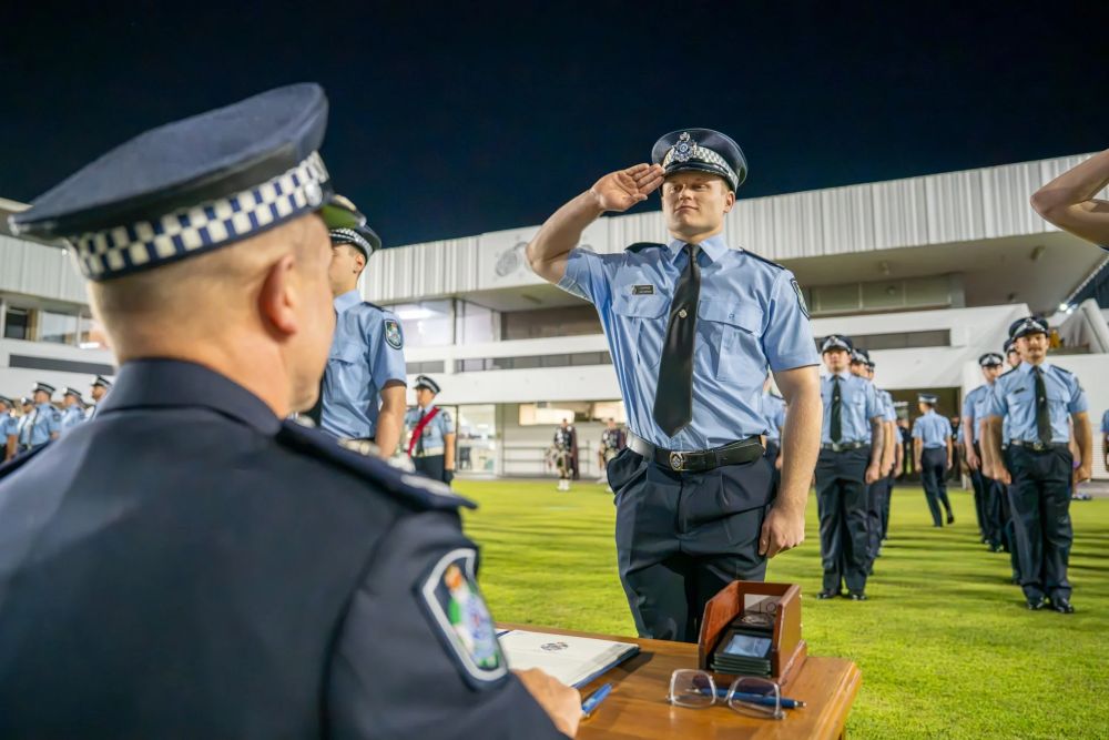 Recruit Jack Jeffrey is sworn in at a graduation ceremony at the Queensland Police Service Academy.