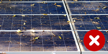 Needs work: Solar panels covered in dirt and debris. These panels may be performing badly.