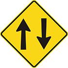 yellow diamond-shaped sign with 1 arrow pointing upward and a parallel one pointing downward