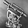 Surveying instrument that has the telescope and spirit level supported on two Y-shaped mounts