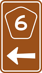 brown sign with pentagonal route number badge