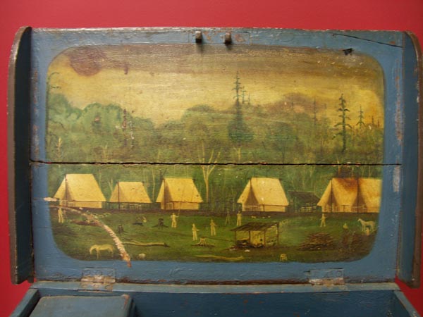 Lid of surveyors box showing the painting of a surveying campsite