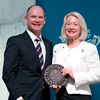 Premier Campbell Newman presenting a plaque to 2013 Queensland Greats award recipient, Dr Dimity Dornan AO.
