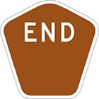 brown pentagonal sign with the word end and blank space