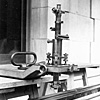Microscope used with an octagonal bar to check steel measuring tapes