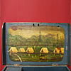 Lid of surveyors box showing the painting of a surveying campsite