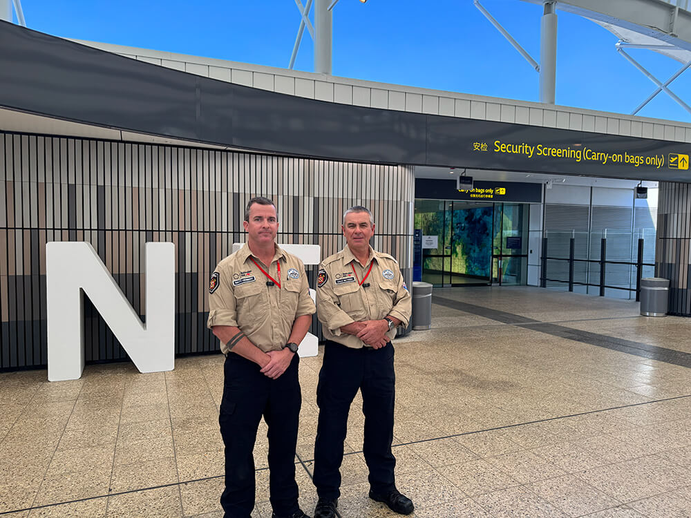 Queensland Fire Department officers Matt Herbert (left) and Dale McVeigh at Brisbane airport before deploying to Nepal.
