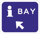 blue sign with a white letter i, the word bay and an arrow