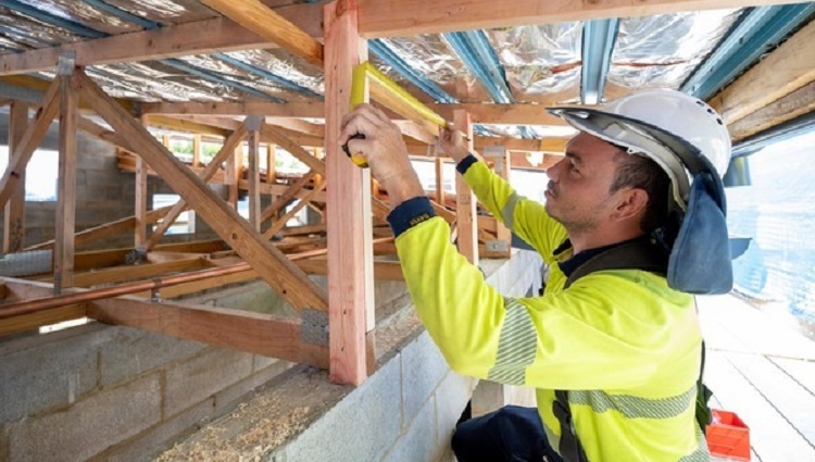 photo of contractor in high vis working on a site