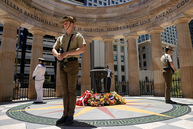 Soldier plays a wind instrument at the Brisbane Shrine of Remembrance