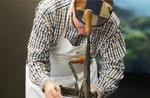 Close-up detail of red overbands laced on parchment strips on a Treasury Department ledger from the 1880s
