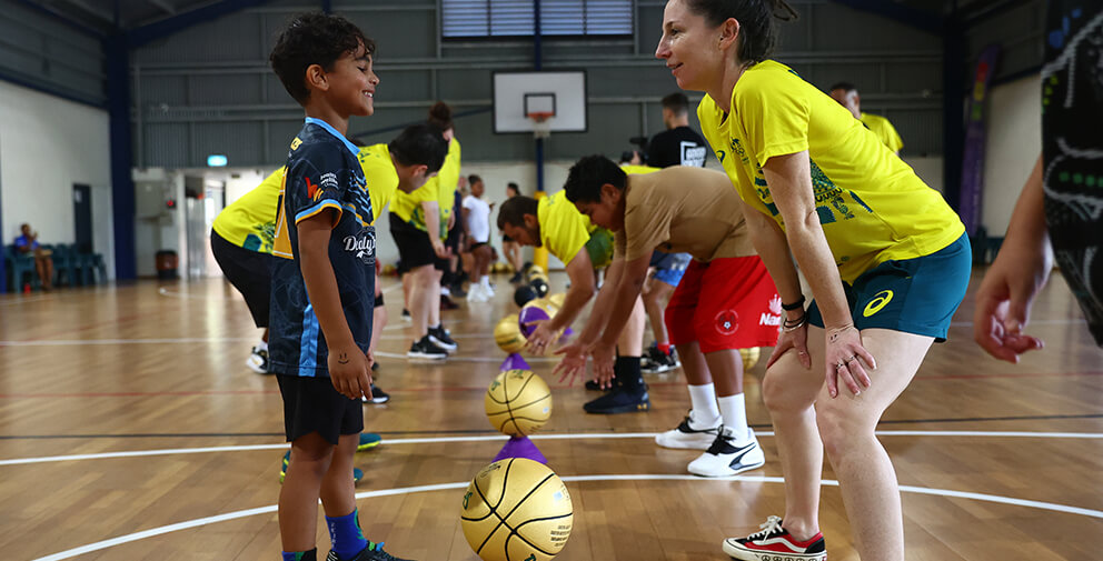 children joyfully engage in a basketball game on a court