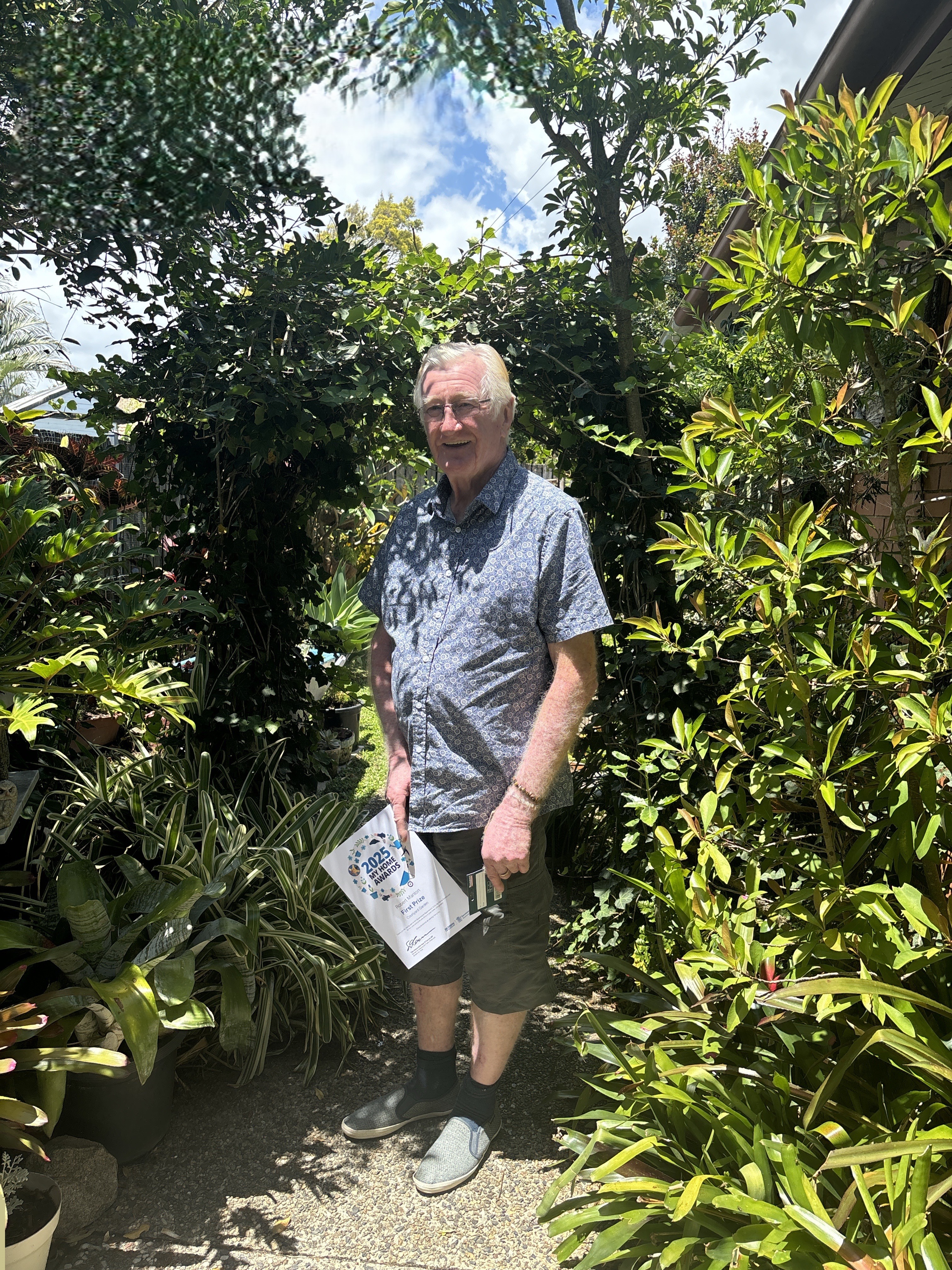 man standing in garden