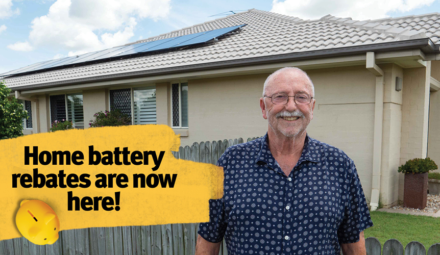 Elderly man is happy in front of his house with solar panels