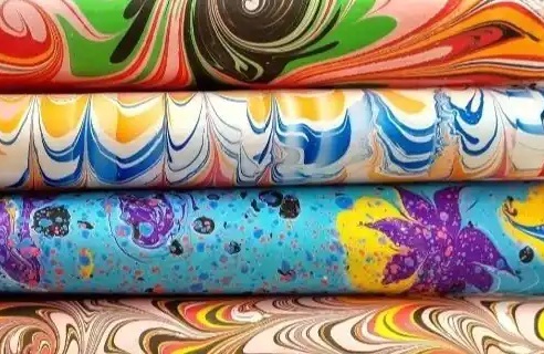 Close-up detail of red overbands laced on parchment strips on a Treasury Department ledger from the 1880s