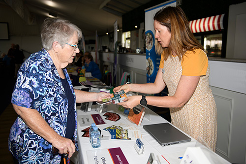An exhibitor speaking with a visitor at the Toowoomba expo